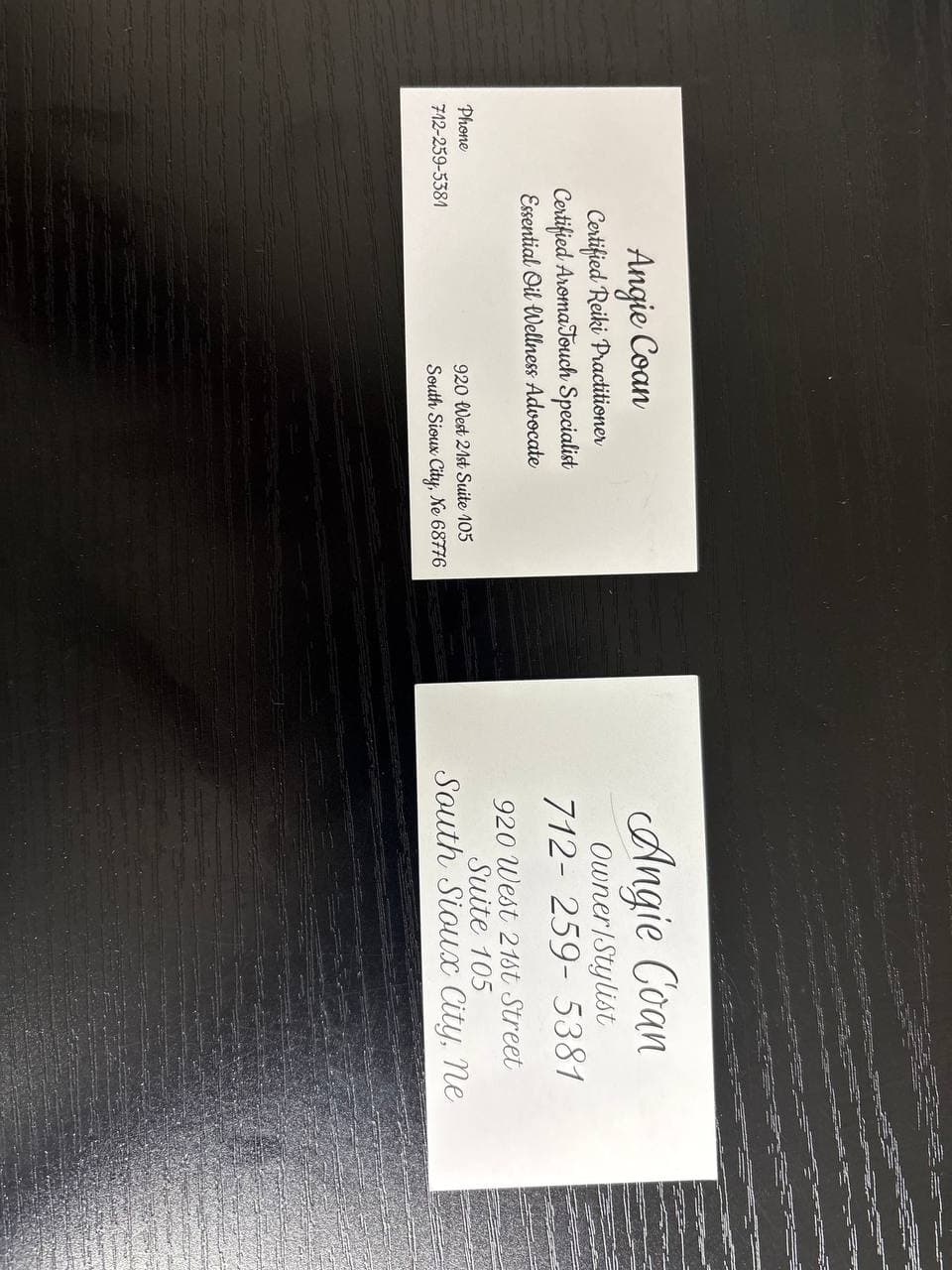 Angie Coan business cards showing Reiki, AromaTouch, and essential oil certifications